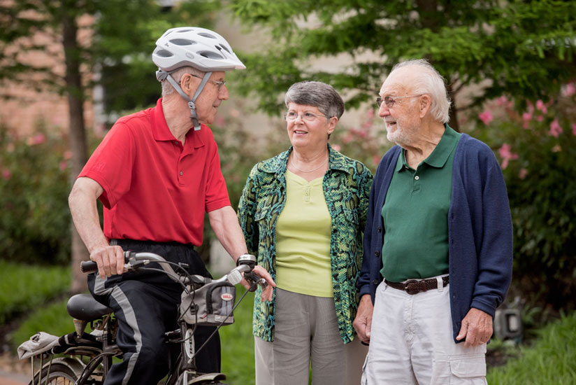 talking to friends on a break from biking