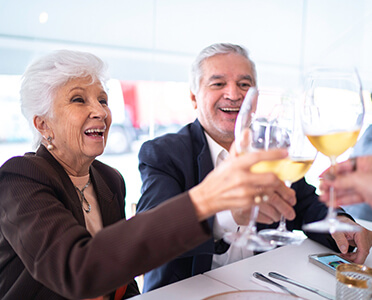 senior drinking wine