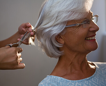woman receiving haircut