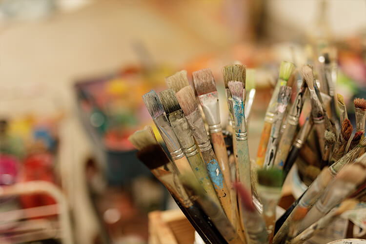 paintbrushes in cup