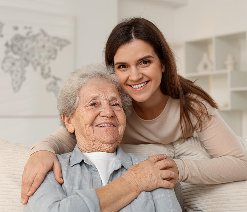 senior smiling at daugther