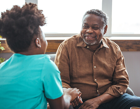 senior man talking to employee