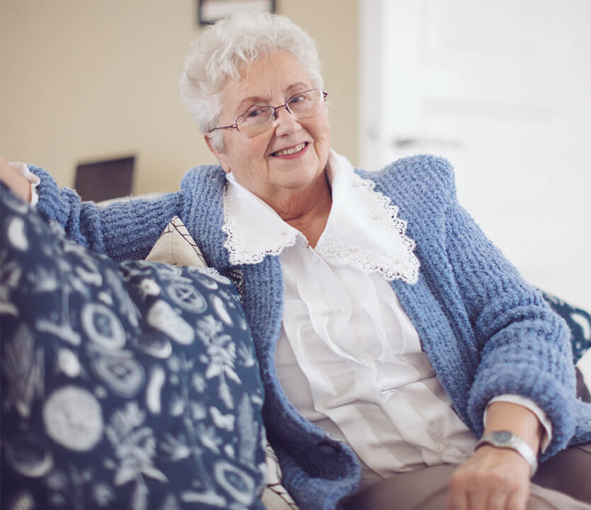 Senior woman relaxing on her couch