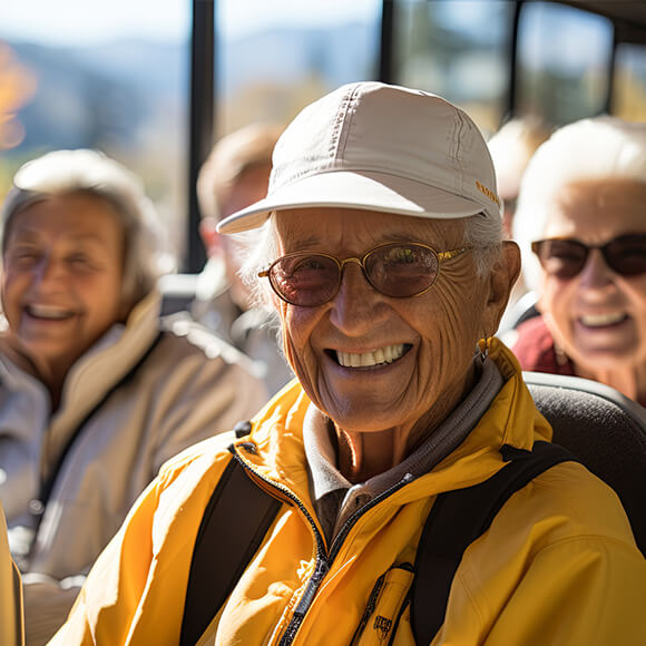 Smiling seniors enjoying an outdoor excursion on a sunny day.