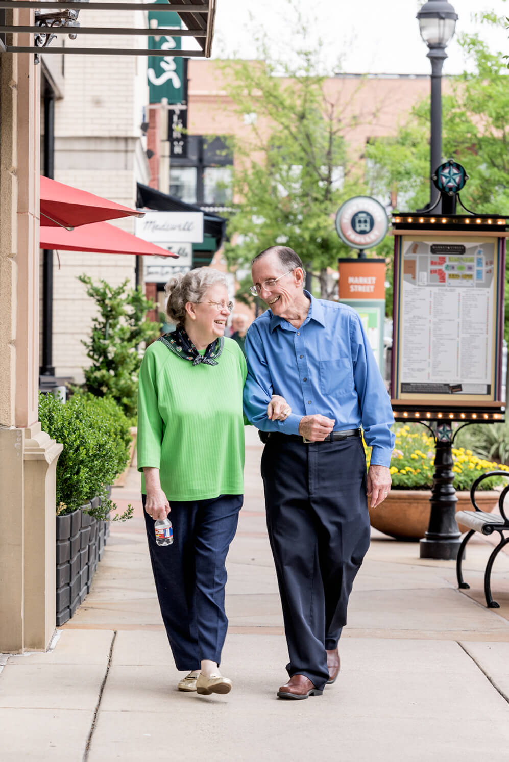 senior couple walking down the street