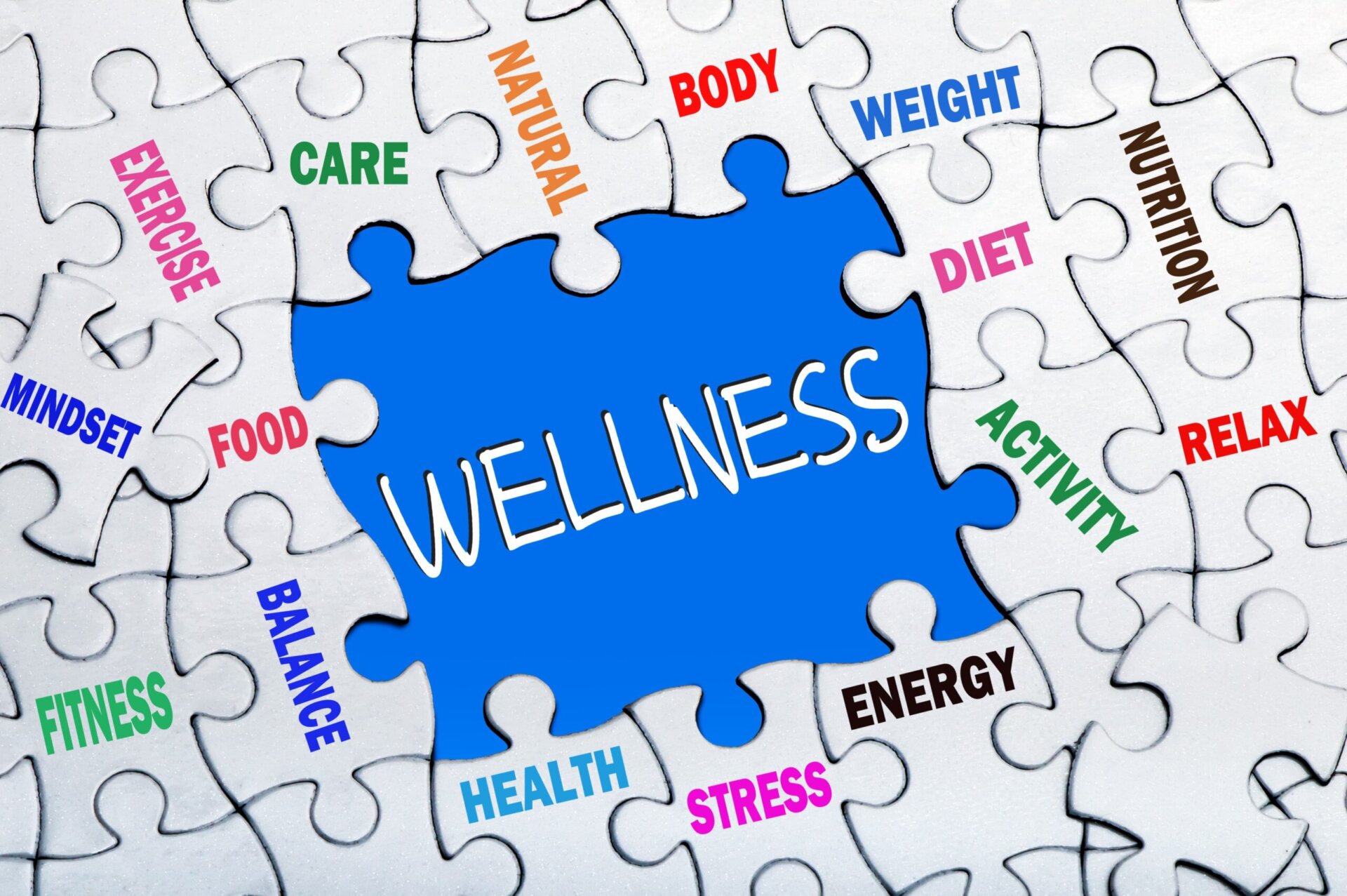 Colorful wellness word cloud puzzle with words like wellness, exercise, health, body, care, and diet.